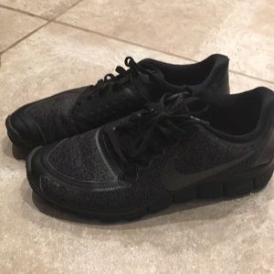 Black Nike Free 5.0 running shoes